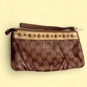 GUCCI
Authentic Brown/Gold Gucci GG Coated Canvas Babouska Pochette Bag
